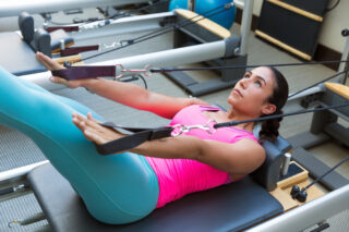 Pilates: <strong><em>A Holistic Approach To Fitness and Well-being</em></strong>