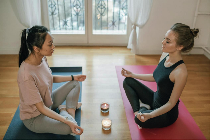 Yoga vs Ayurveda comparison infographic showing how each ancient system addresses mental health differently and how combined practice creates complete wellness support.