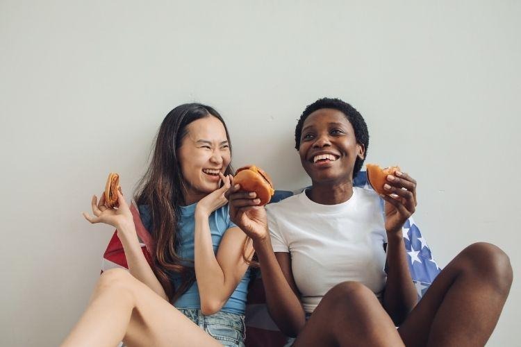 Women Eating Burgers in their Shared Accommodation