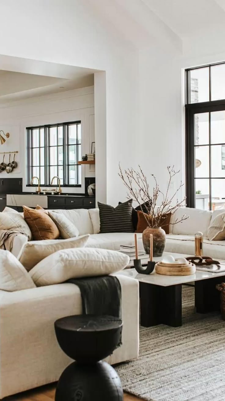 open layout living room connected to kitchen with natural light