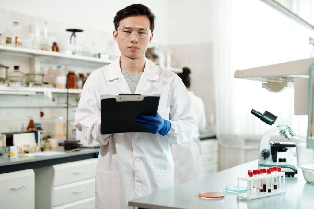 Scientist in a laboratory showing how researchers study therapeutic compounds.